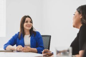 woman having a conversation with her colleague